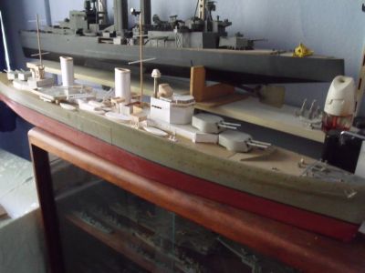 HMS Ajax being converted to HMAS Sydney, HMS Exeter in background
